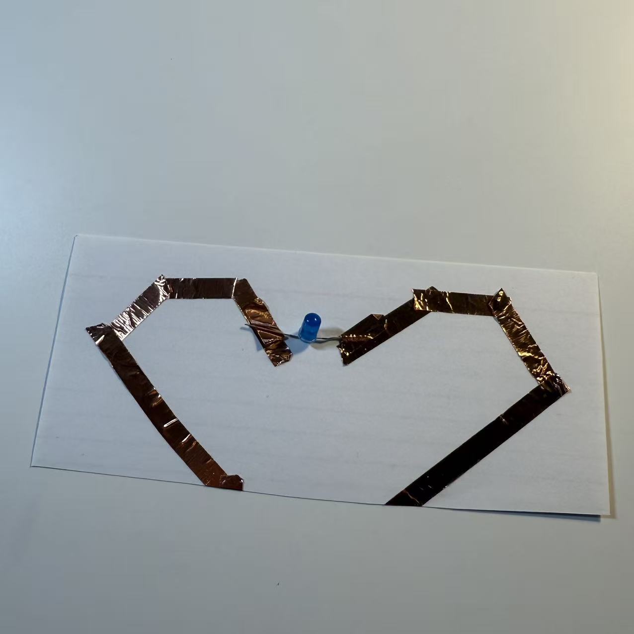 Made a heart shape circuit with conductive tape and using makey makey wire